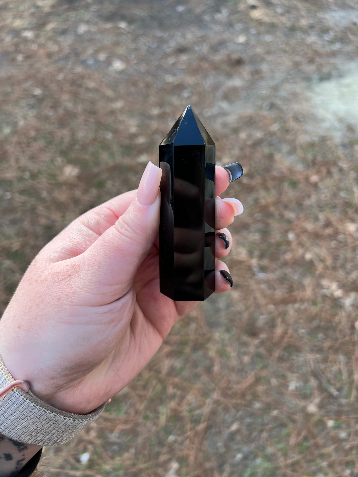 Black obsidian chakra carved chipped tower.